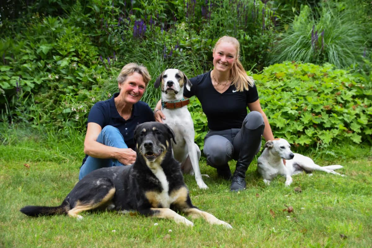 Caroline with dogs in the garden